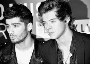 NEW YORK, NY - AUGUST 25: (EDITORS NOTE: Image has been converted to black and white.) Zayn Malik (L) and Harry Styles of One Direction attend the 2013 MTV Video Music Awards at the Barclays Center on August 25, 2013 in the Brooklyn borough of New York City. (Photo by Stephen Lovekin/Getty Images for MTV)
